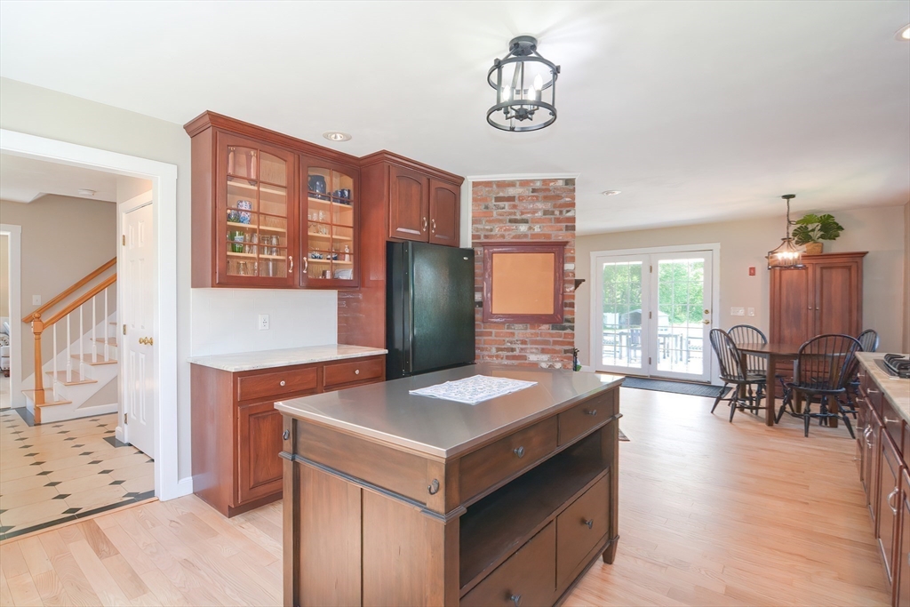 13 Park Street Mendon, MA 01756 - Photo 7 of 37 a kitchen that has a lot of cabinets in it