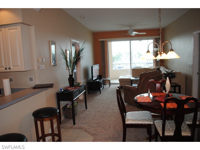 2060 Matecumbe Key Road Punta Gorda, FL 33955 - Photo 4 of 16 a view of a dining room with furniture and a window