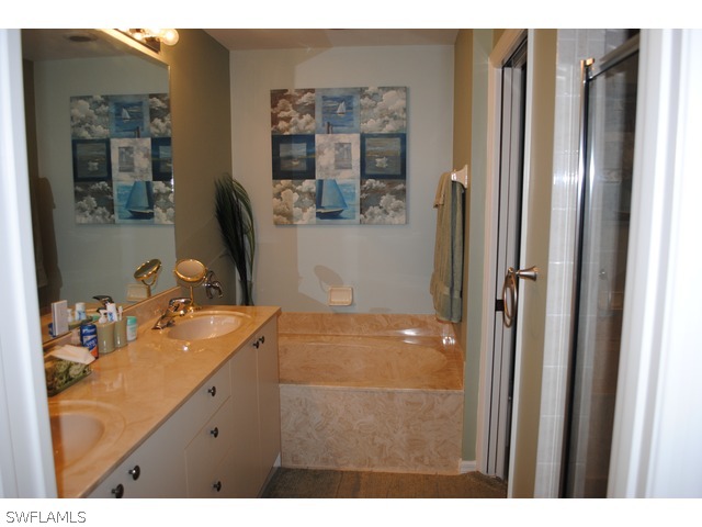 2060 Matecumbe Key Road Punta Gorda, FL 33955 - Photo 8 of 16 a bathroom with a sink vanity and mirror