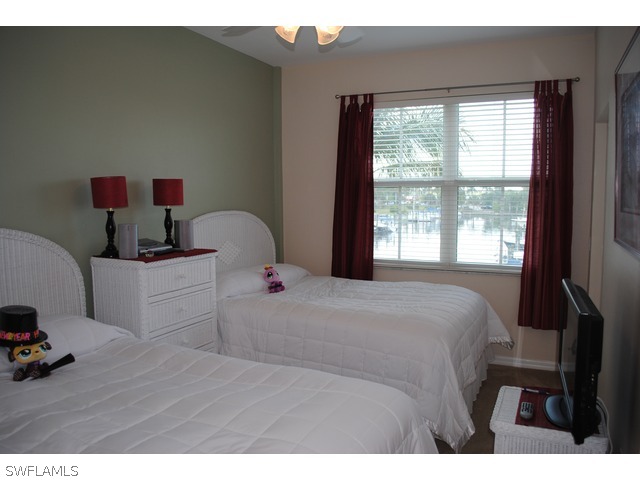 2060 Matecumbe Key Road Punta Gorda, FL 33955 - Photo 9 of 16 a bedroom with a bed and a window