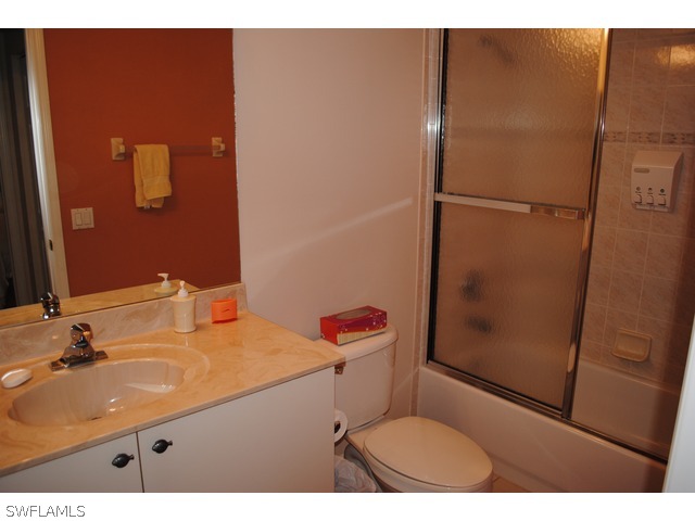 2060 Matecumbe Key Road Punta Gorda, FL 33955 - Photo 10 of 16 a bathroom with a sink and a mirror