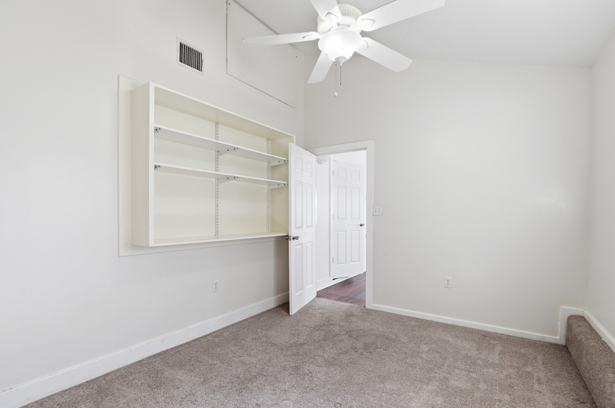 128 Skyview Terrace Leander, TX 78641 - Photo 18 of 23 Unfurnished room with carpet, shelving and ceiling fan