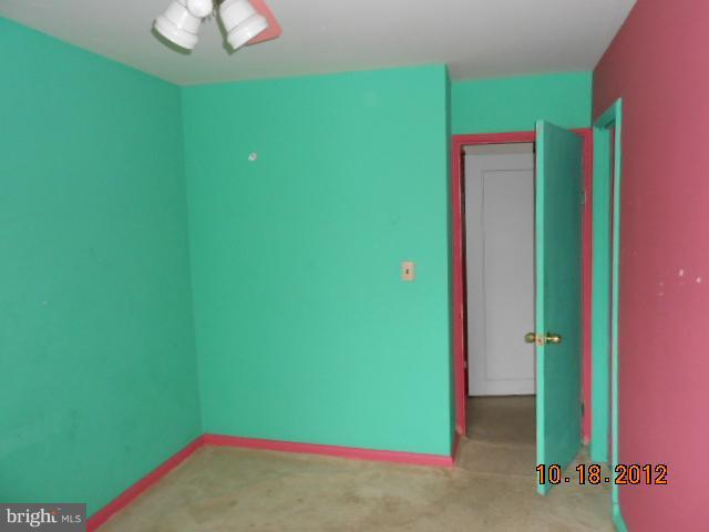 7444 Durwood Road Baltimore, MD 21222 - Photo 11 of 11 a view of a room with a cabinets and a potted plant