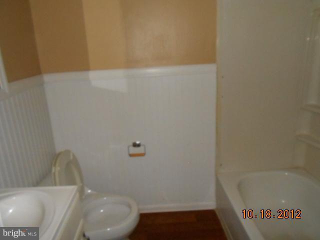 7444 Durwood Road Baltimore, MD 21222 - Photo 10 of 11 a bathroom with a bathtub