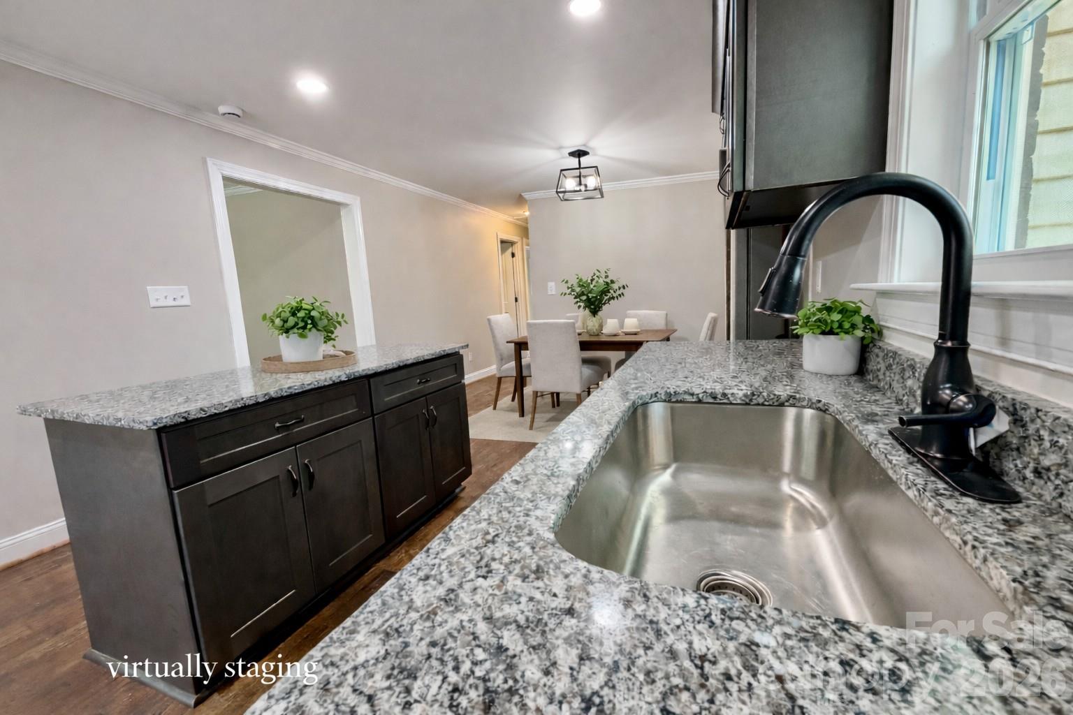 2201 Airdale Road Lancaster, SC 29720 - Photo 12 of 25 a kitchen with a refrigerator sink and wooden cabinets