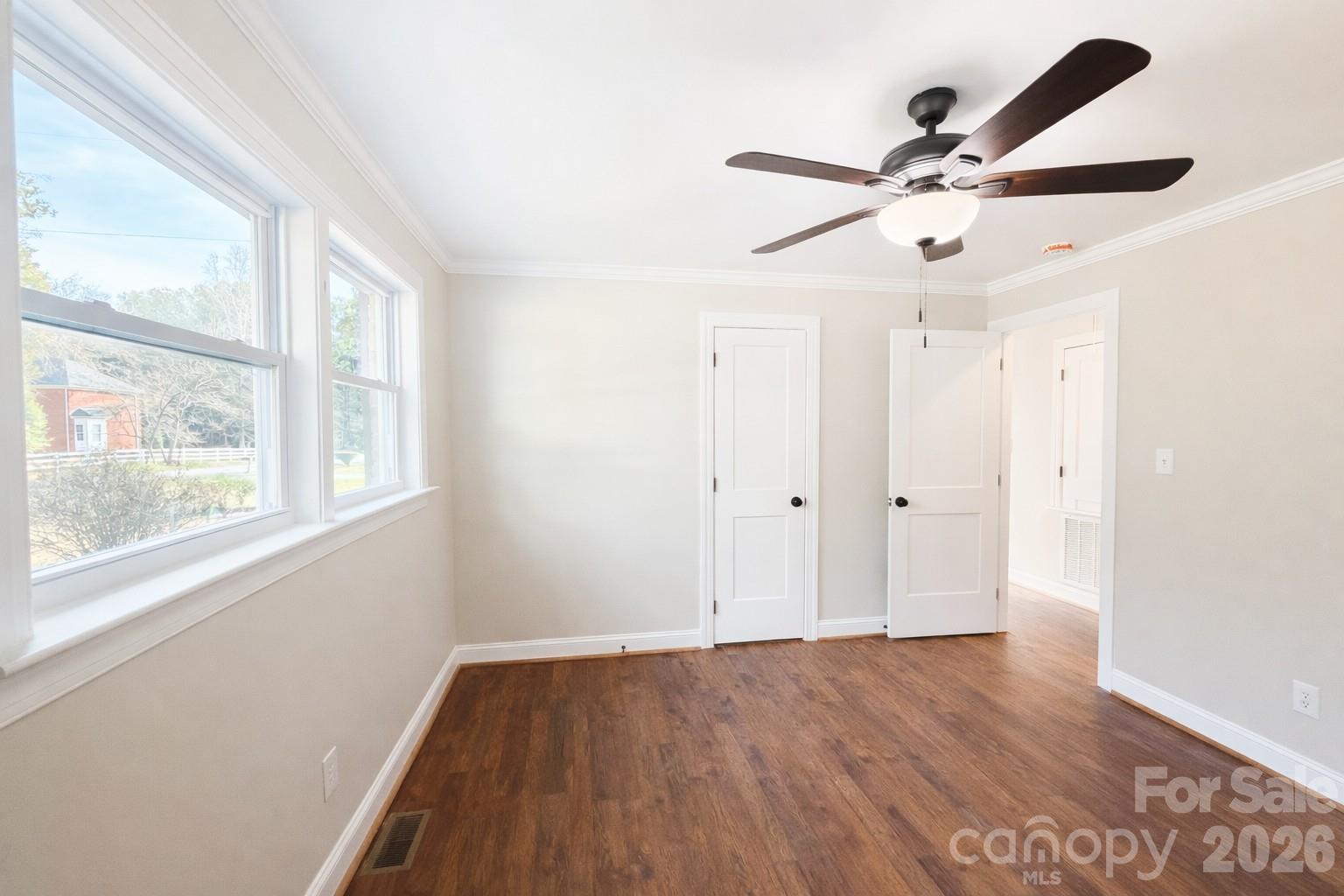 2201 Airdale Road Lancaster, SC 29720 - Photo 25 of 25 an empty room with wooden floor fan and windows