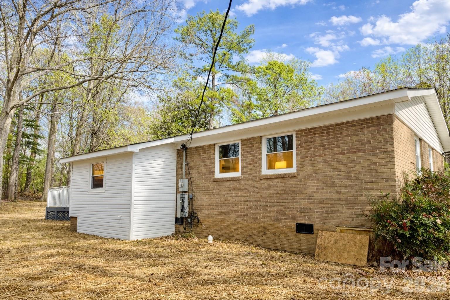 2201 Airdale Road Lancaster, SC 29720 - Photo 3 of 25 a backyard of a house with large tree