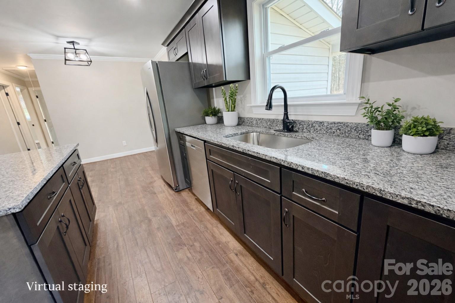 2201 Airdale Road Lancaster, SC 29720 - Photo 10 of 25 a kitchen with granite countertop a sink a stove and refrigerator