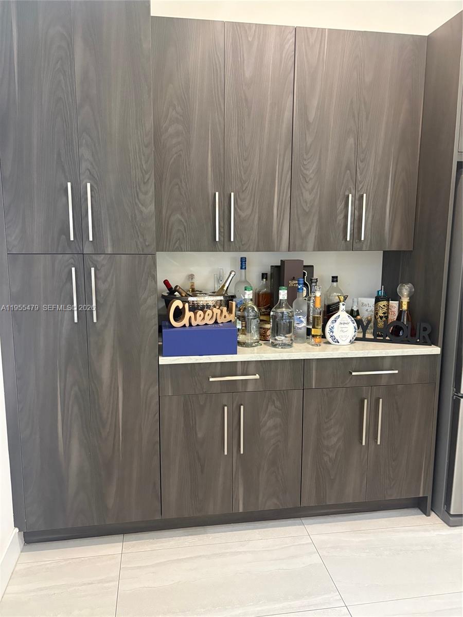 15062 Southwest 177th Terrace Miami, FL 33187 - Photo 13 of 41 a kitchen with a sink and cabinets