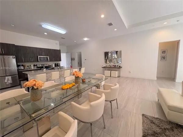 a dining room with furniture and wooden floor