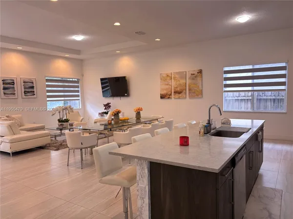 a living room with fireplace furniture and a wooden floor