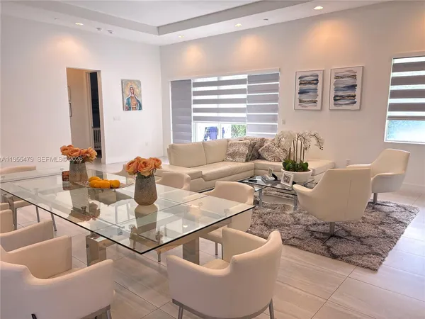 a bathroom with a double vanity sink mirror double and shower