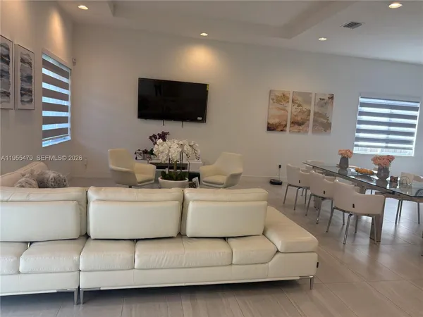 a bathroom with a sink mirror vanity and toilet