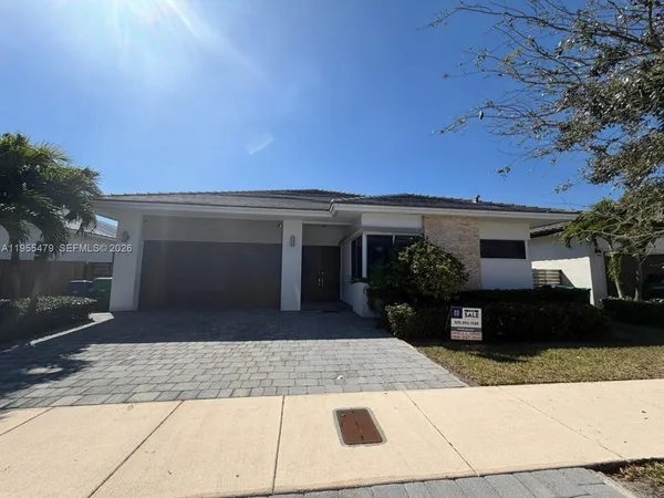 a view of a car parked in front of a house