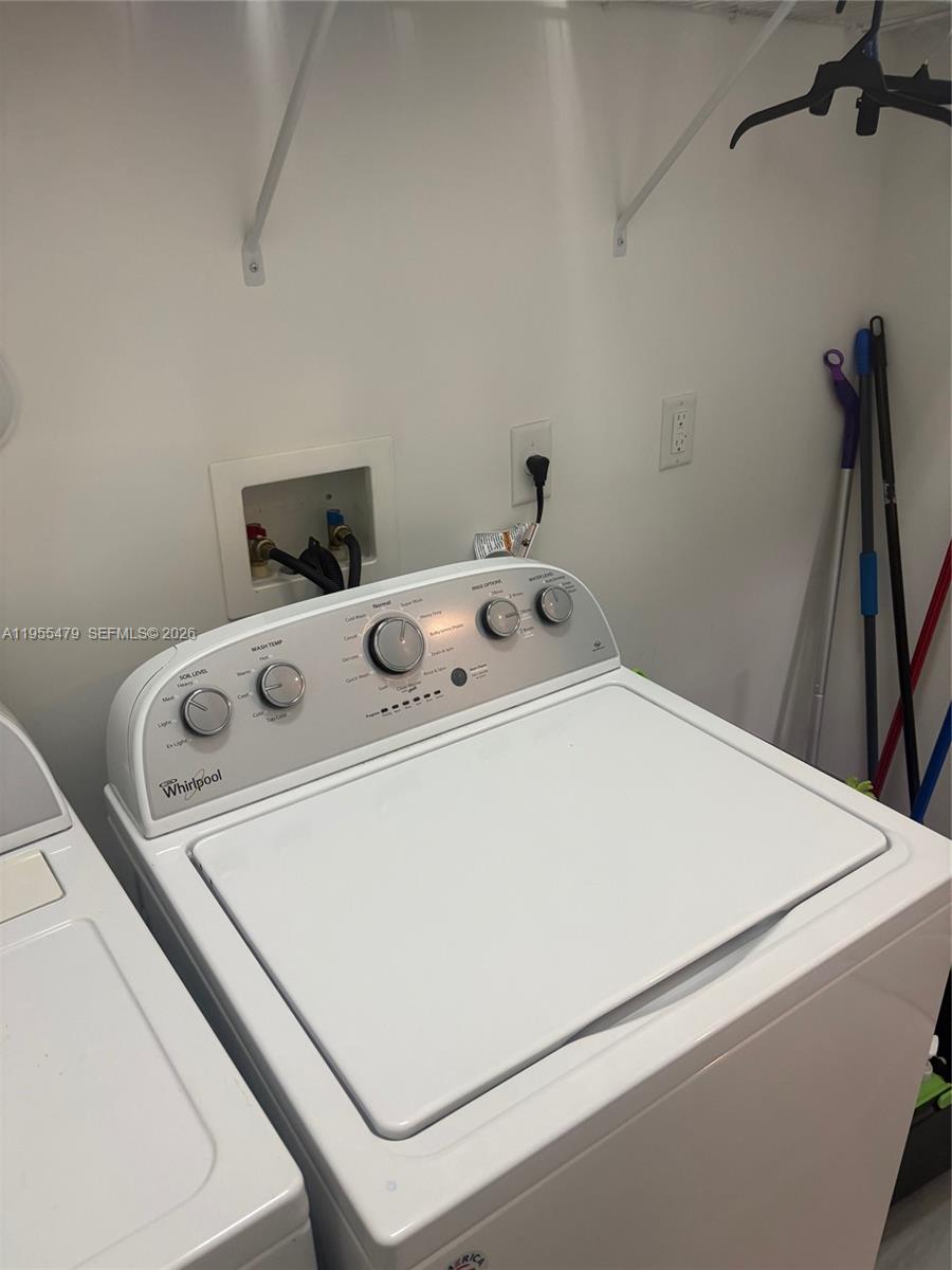 15062 Southwest 177th Terrace Miami, FL 33187 - Photo 34 of 41 a utility room with dryer and washer