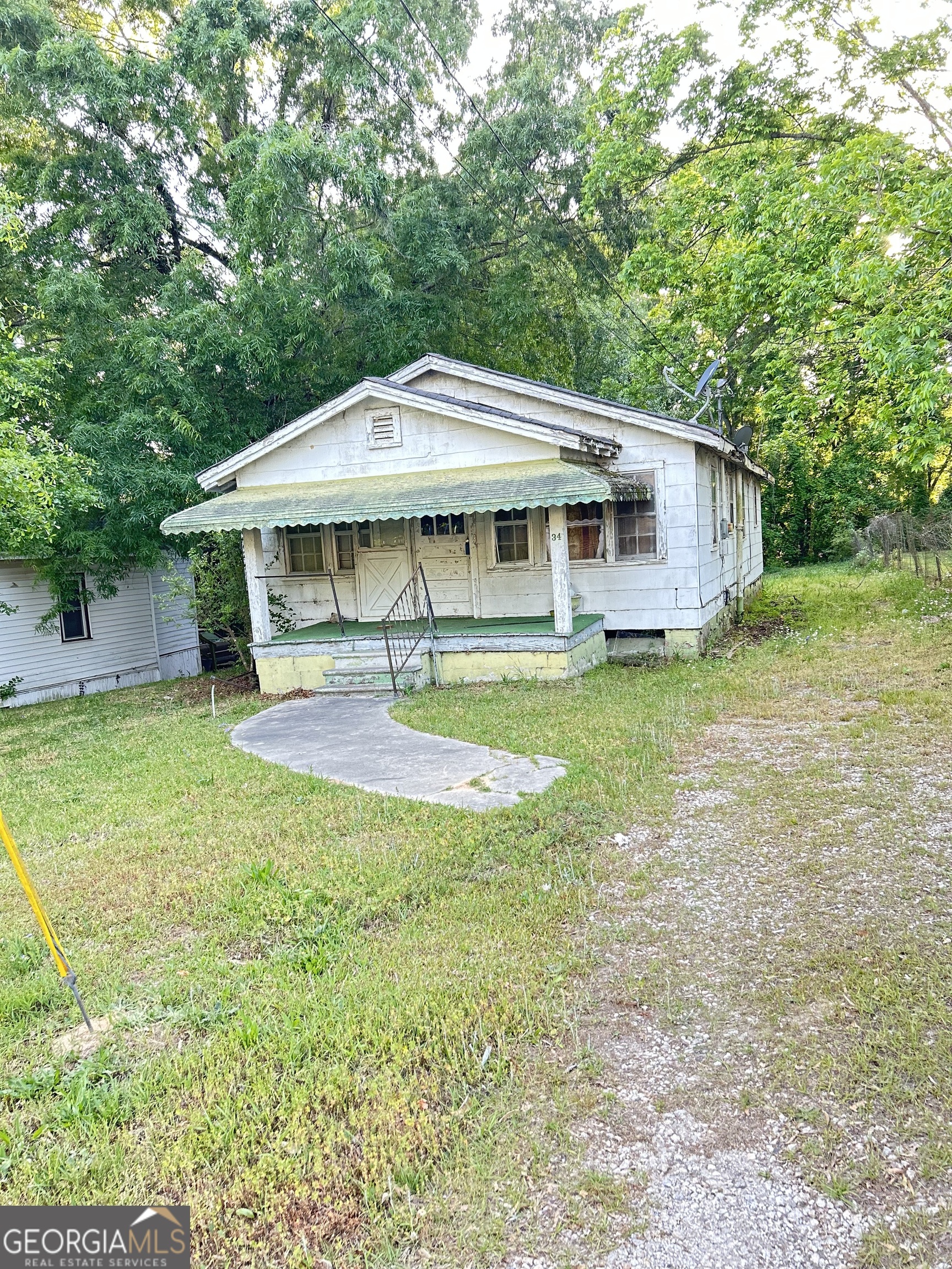 34 Jackson Street Barnesville, GA 30204 - Photo 2 of 4 a view of a house with a backyard