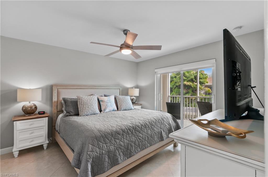 3150 Binnacle Drive, Unit 209 2J Naples, FL 34103 - Photo 13 of 32 a bedroom with a bed and a window