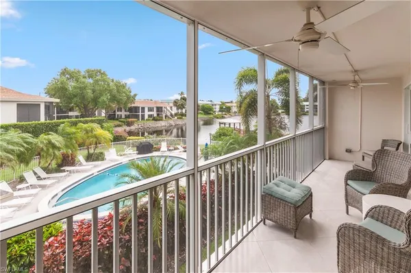 a view of balcony with furniture