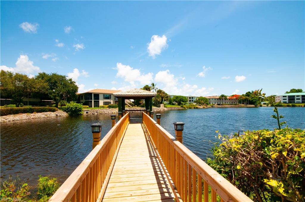 3150 Binnacle Drive, Unit 209 2J Naples, FL 34103 - Photo 29 of 32 a view of swimming pool with a lake view