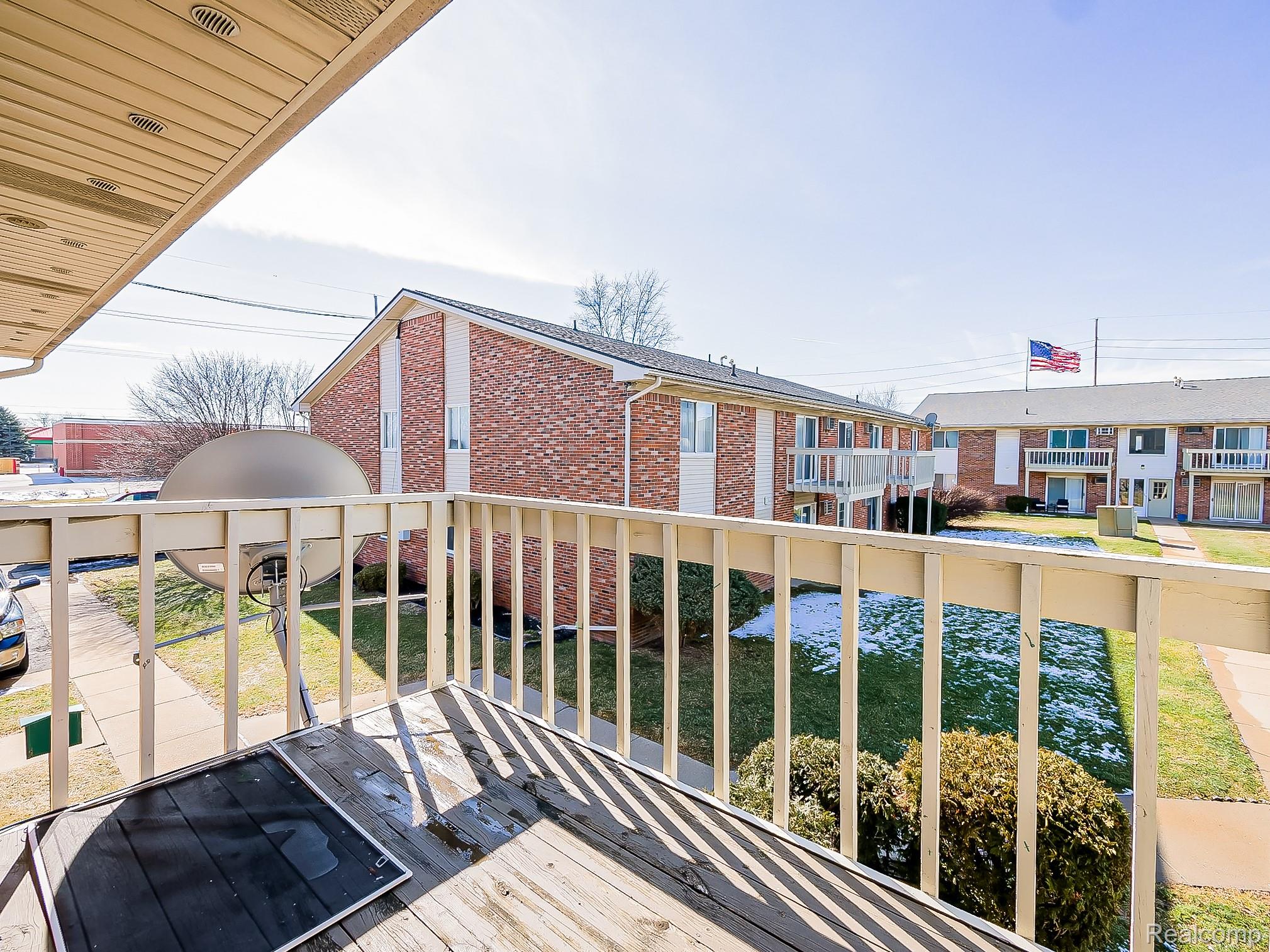 125 East Van Riper Road, Unit 7 Fowlerville, MI 48836 - Photo 21 of 26 View of balcony