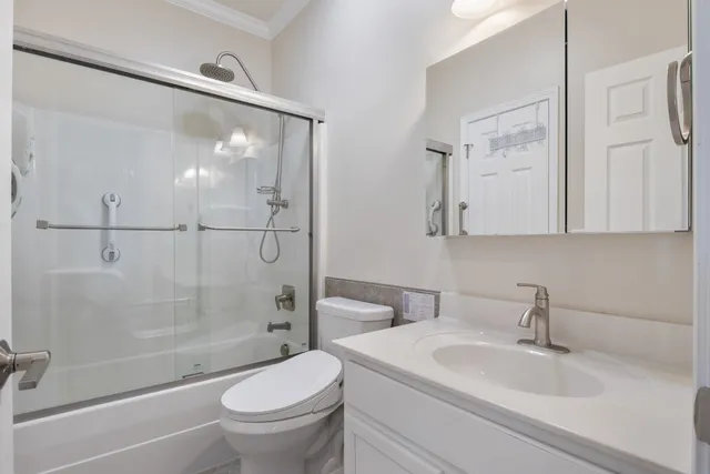 a bedroom with a bed couch and window