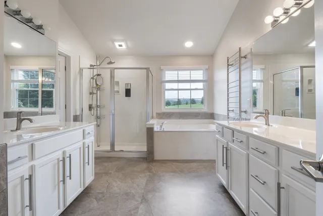 a view of walk in closet with clothes