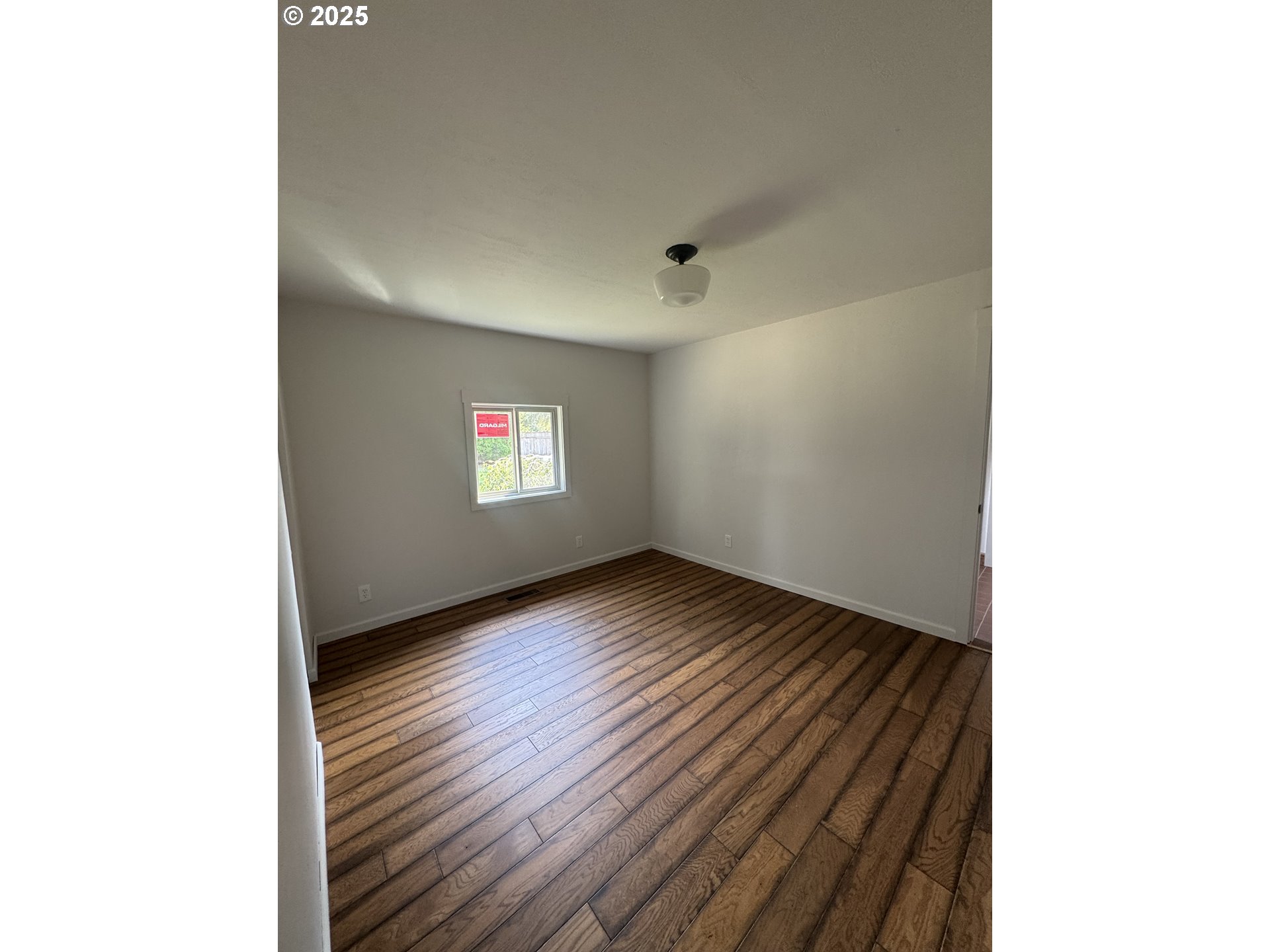 78641 Paul Smith Road Southwest Boardman, OR 97818 - Photo 8 of 32 a view of an empty room and window