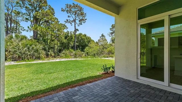 a view of an entrance to house with yard