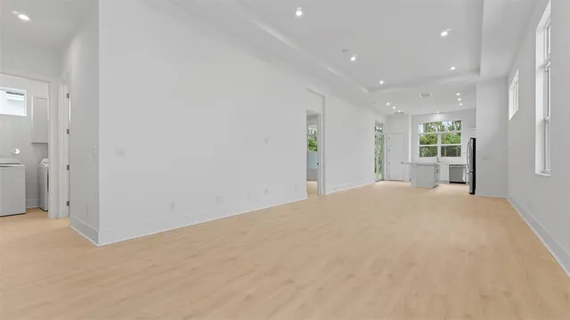 a view of a big room with closet and windows