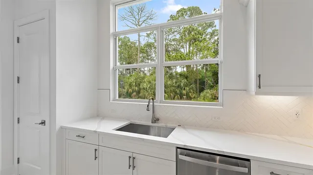 a kitchen with a sink and a window