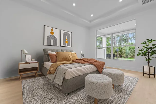 a bedroom with bed and window