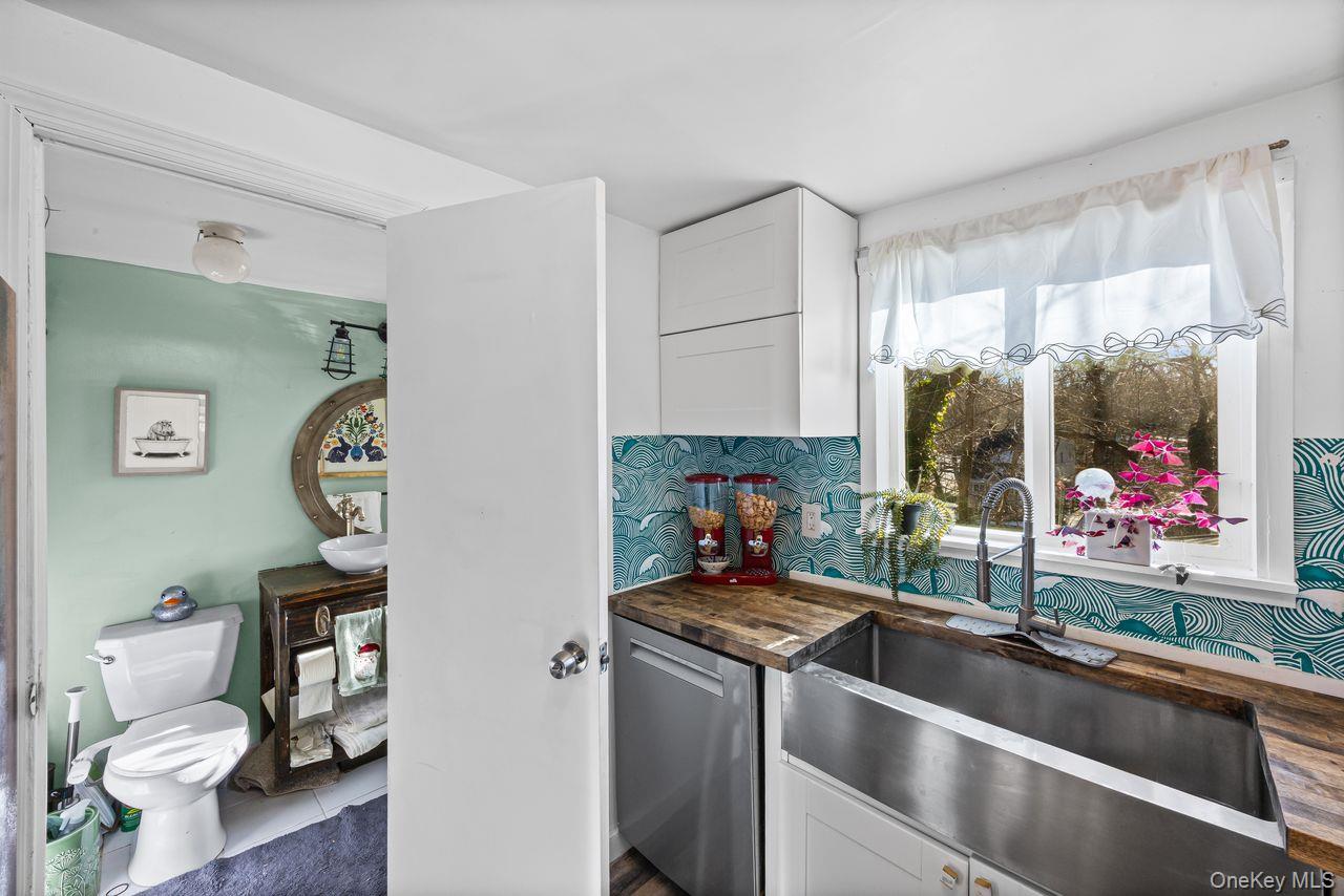 50 Poseidon Road Rocky Point, NY 11778 - Photo 12 of 47 a view of living room with furniture and a potted plant