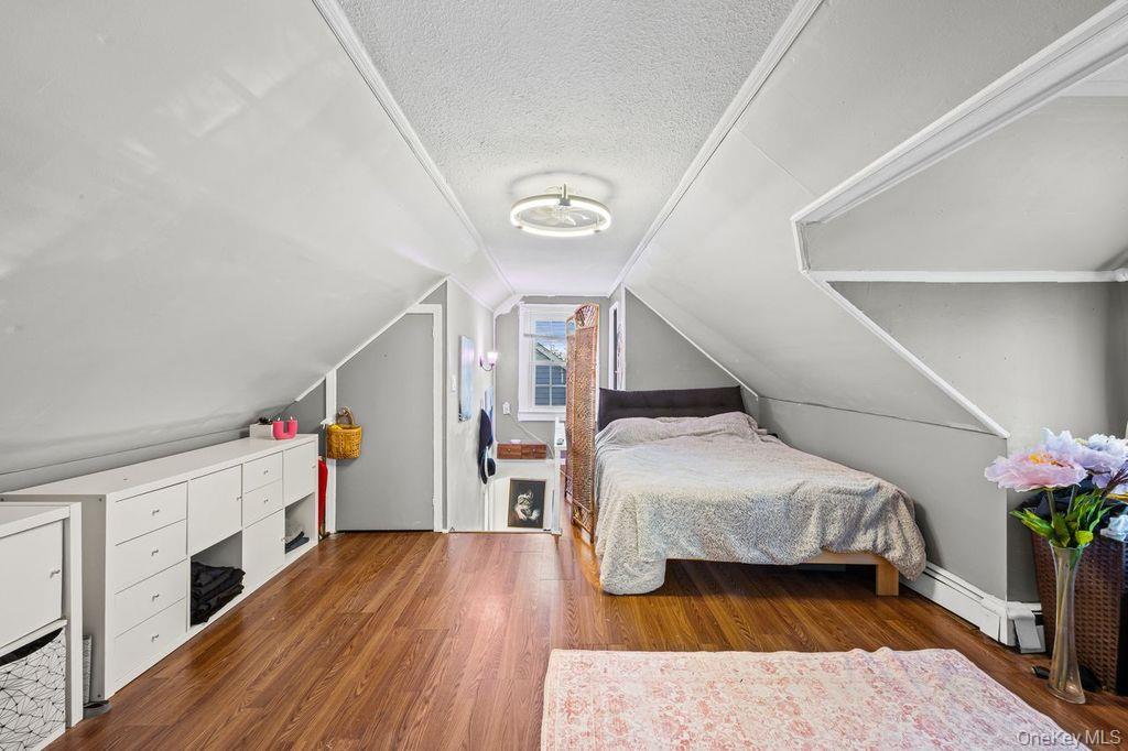 50 Poseidon Road Rocky Point, NY 11778 - Photo 21 of 47 a room with stairs and wooden floor