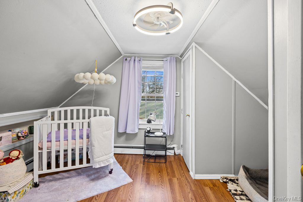 50 Poseidon Road Rocky Point, NY 11778 - Photo 23 of 47 a view of a livingroom with wooden floor and a window