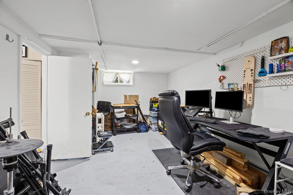 50 Poseidon Road Rocky Point, NY 11778 - Photo 27 of 47 a view of a workspace with furniture and a window