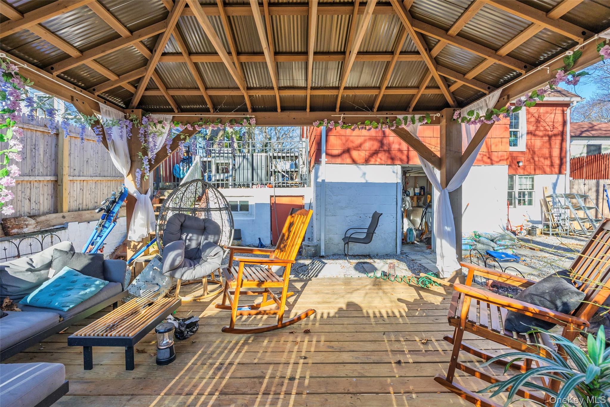 50 Poseidon Road Rocky Point, NY 11778 - Photo 36 of 47 a view of a porch with a table and chairs