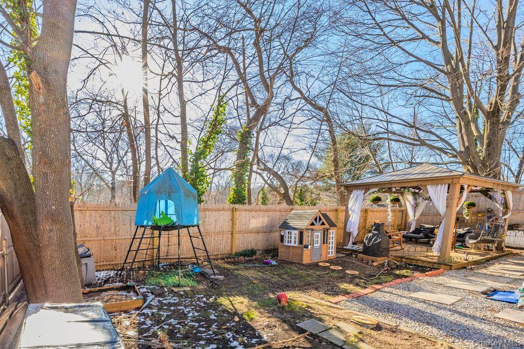 50 Poseidon Road Rocky Point, NY 11778 - Photo 37 of 47 a front view of a house with garden