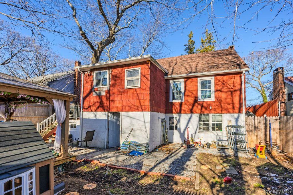 50 Poseidon Road Rocky Point, NY 11778 - Photo 38 of 47 a front view of a house with a yard