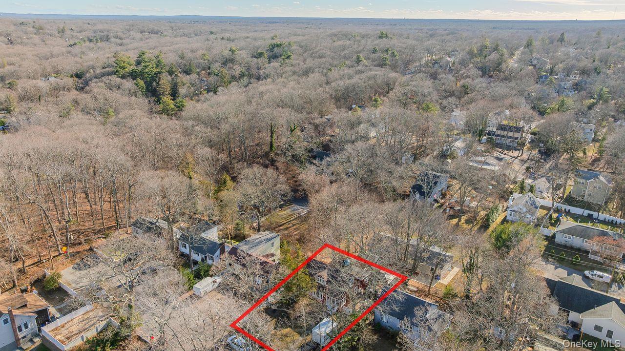 50 Poseidon Road Rocky Point, NY 11778 - Photo 43 of 47 an aerial view of a houses with a yard
