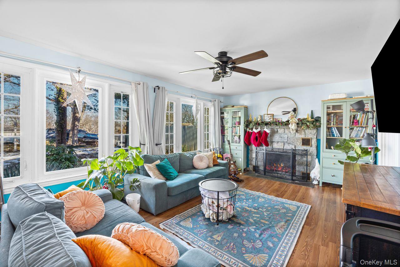 50 Poseidon Road Rocky Point, NY 11778 - Photo 6 of 47 a living room with furniture potted plant kitchen view and a window