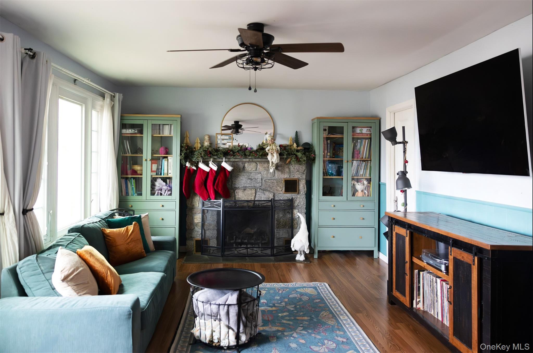 50 Poseidon Road Rocky Point, NY 11778 - Photo 8 of 47 a living room with furniture and a flat screen tv