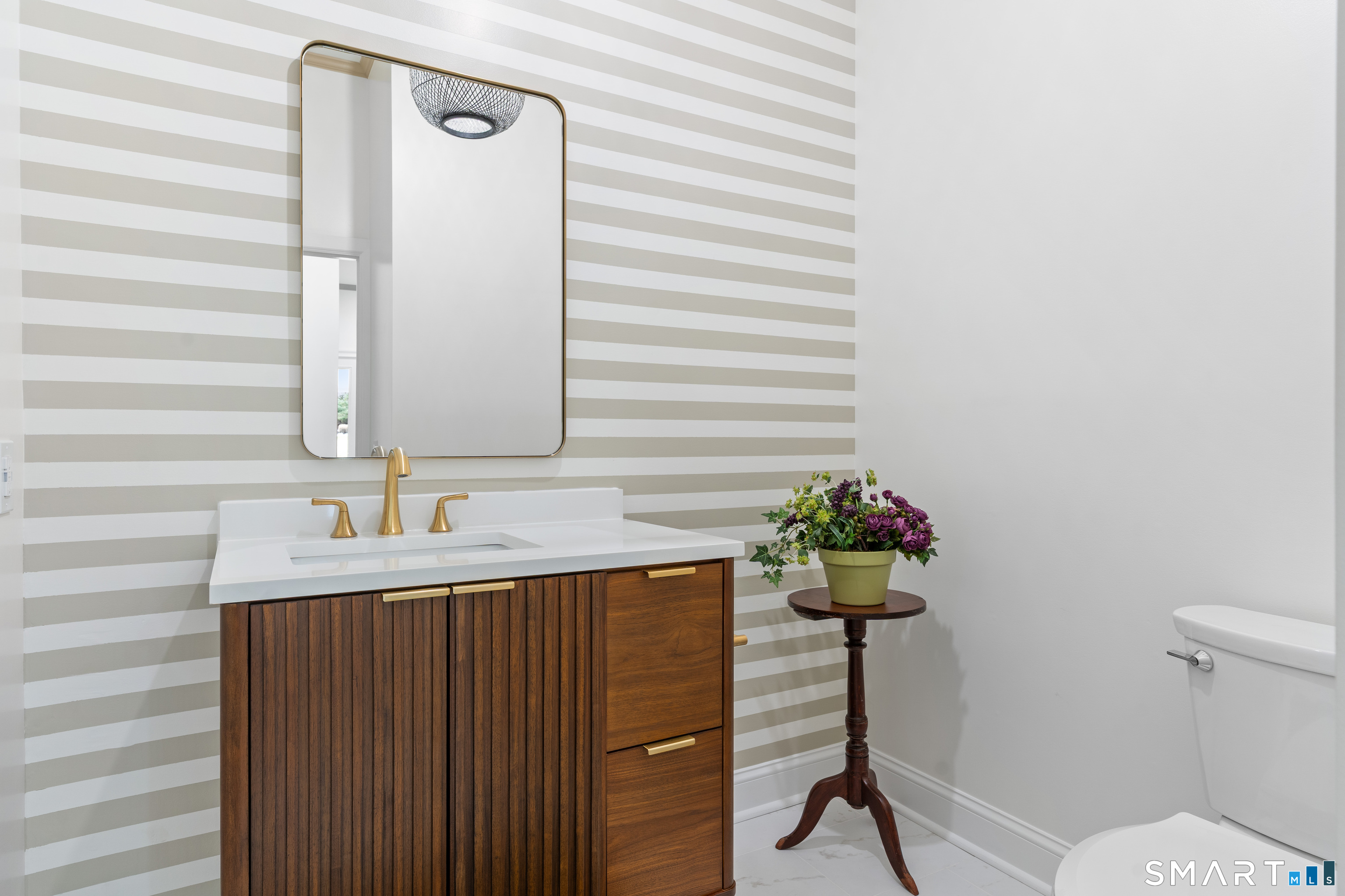 14 Windermere Lane Stamford, CT 06902 - Photo 17 of 45 a bathroom with a sink and a mirror