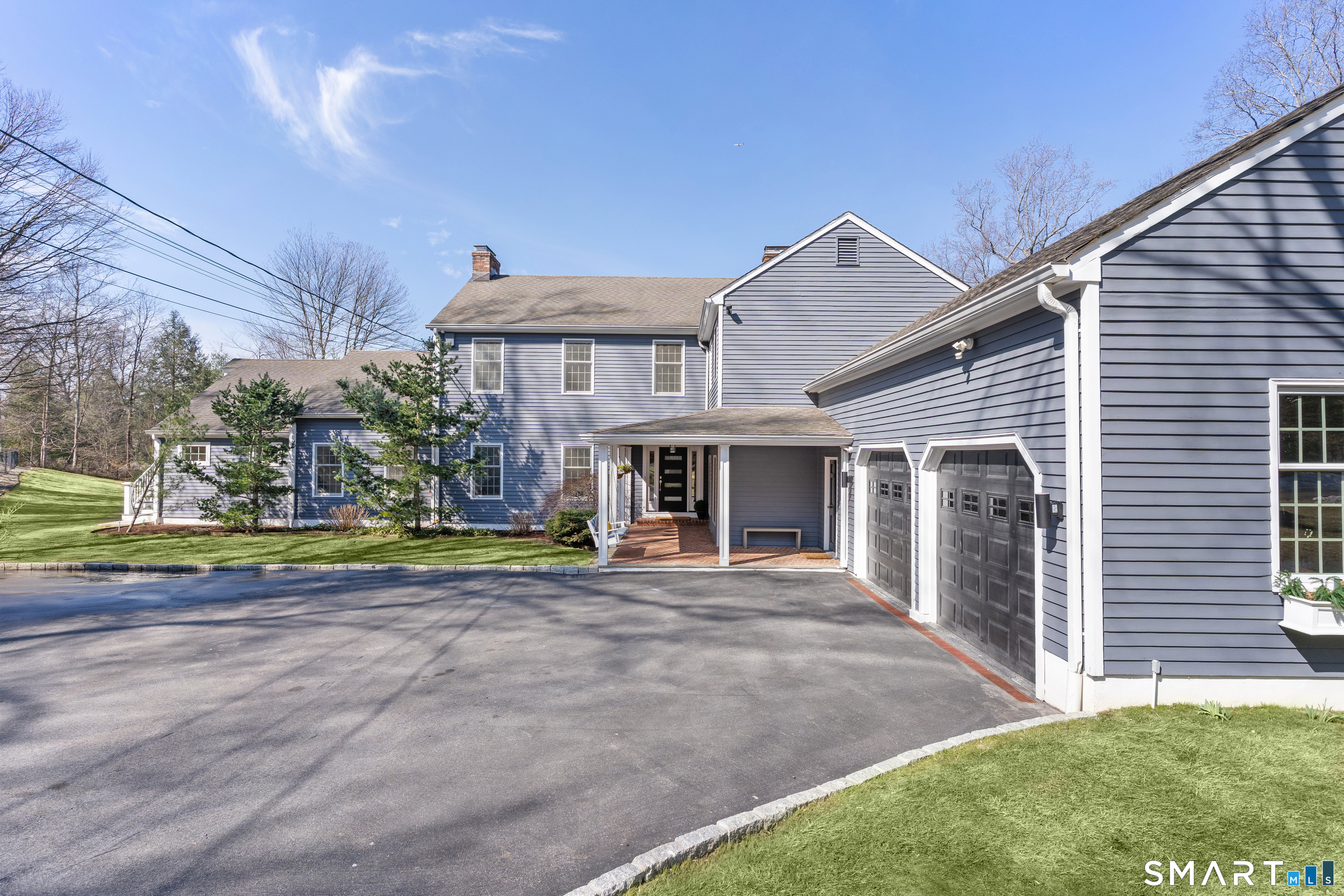 14 Windermere Lane Stamford, CT 06902 - Photo 2 of 40 a view of a house with a yard and sitting area