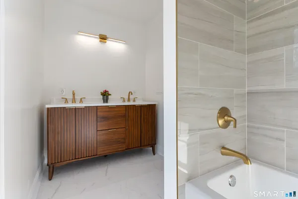 a bathroom with a sink and mirror