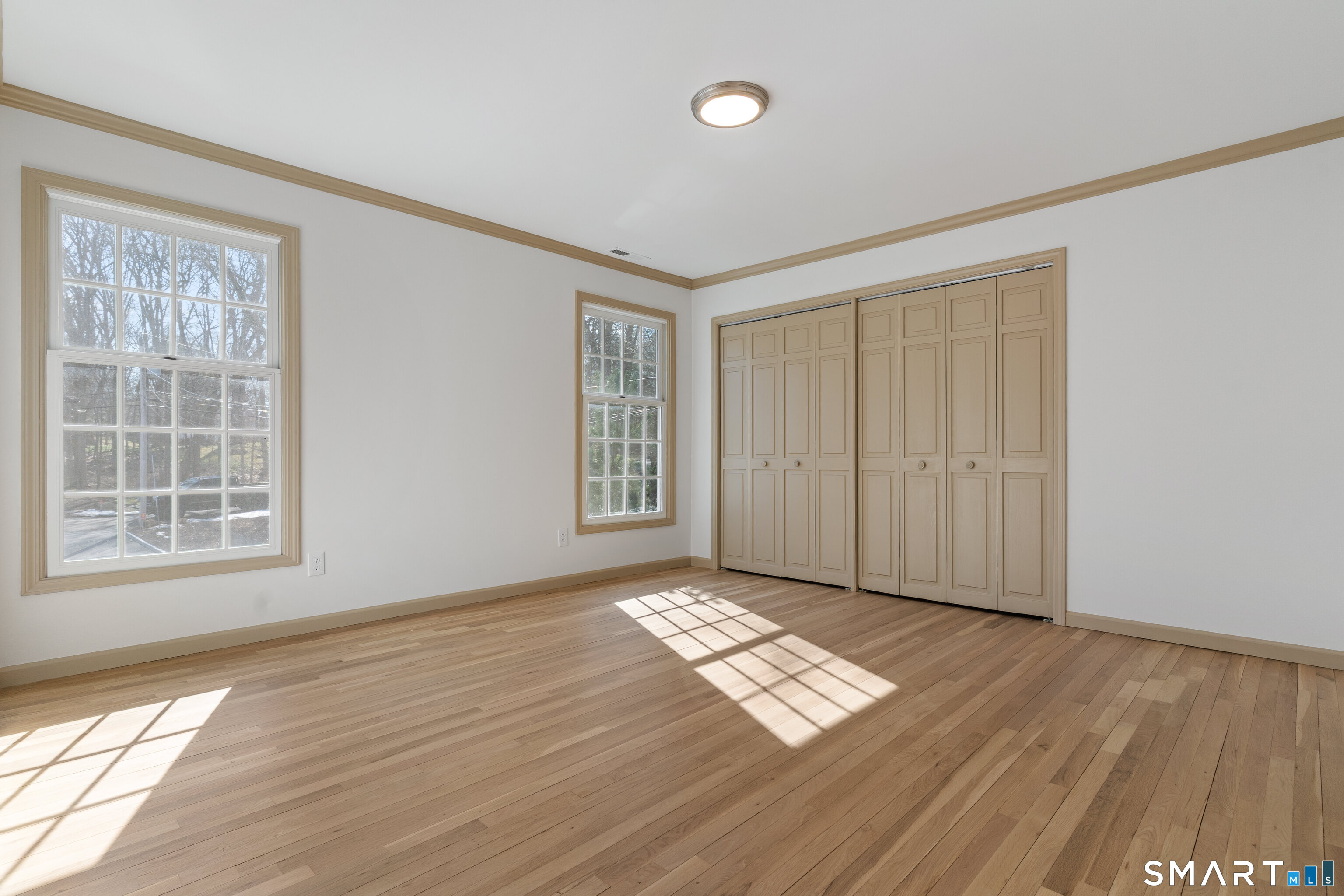 14 Windermere Lane Stamford, CT 06902 - Photo 27 of 45 wooden floor in an empty room with a window