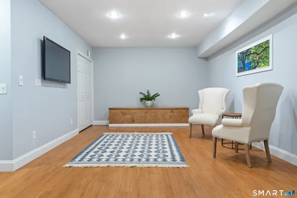 a living room with a couch and a rug