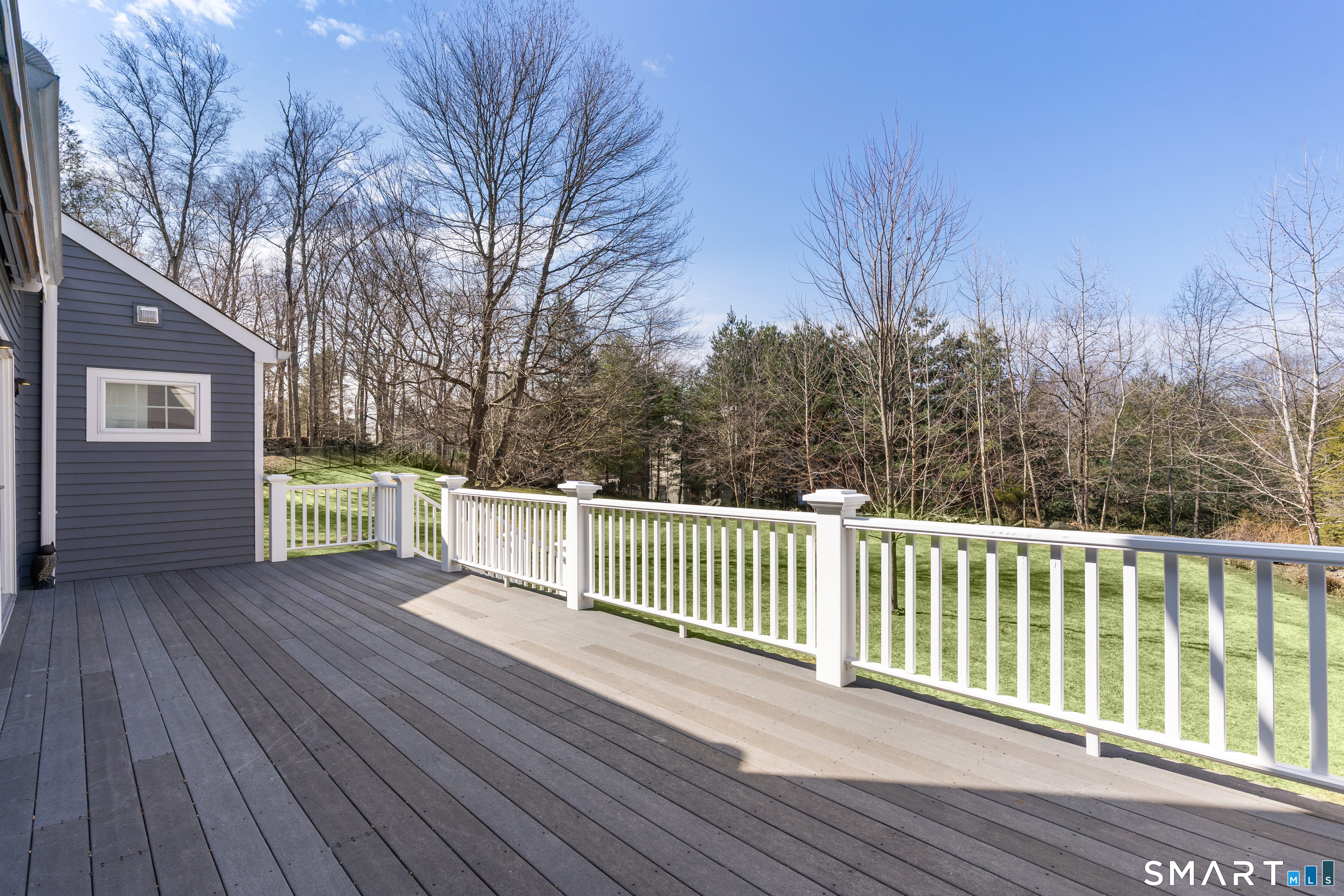 14 Windermere Lane Stamford, CT 06902 - Photo 35 of 40 a view of a deck with a yard and wooden fence