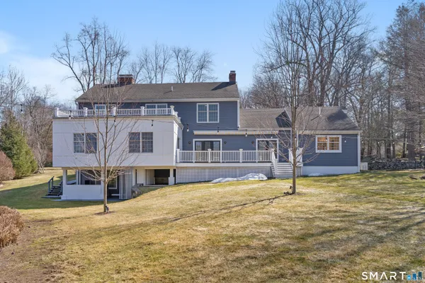 a house that has a tree in front of it