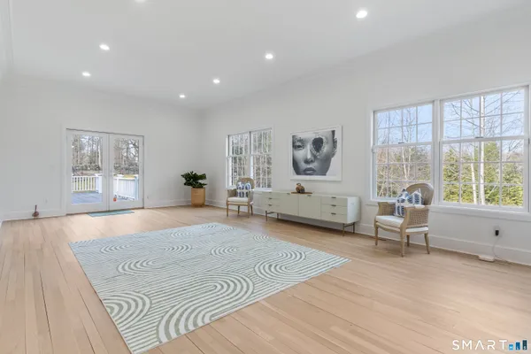 a spacious bedroom with a large bed and a large window