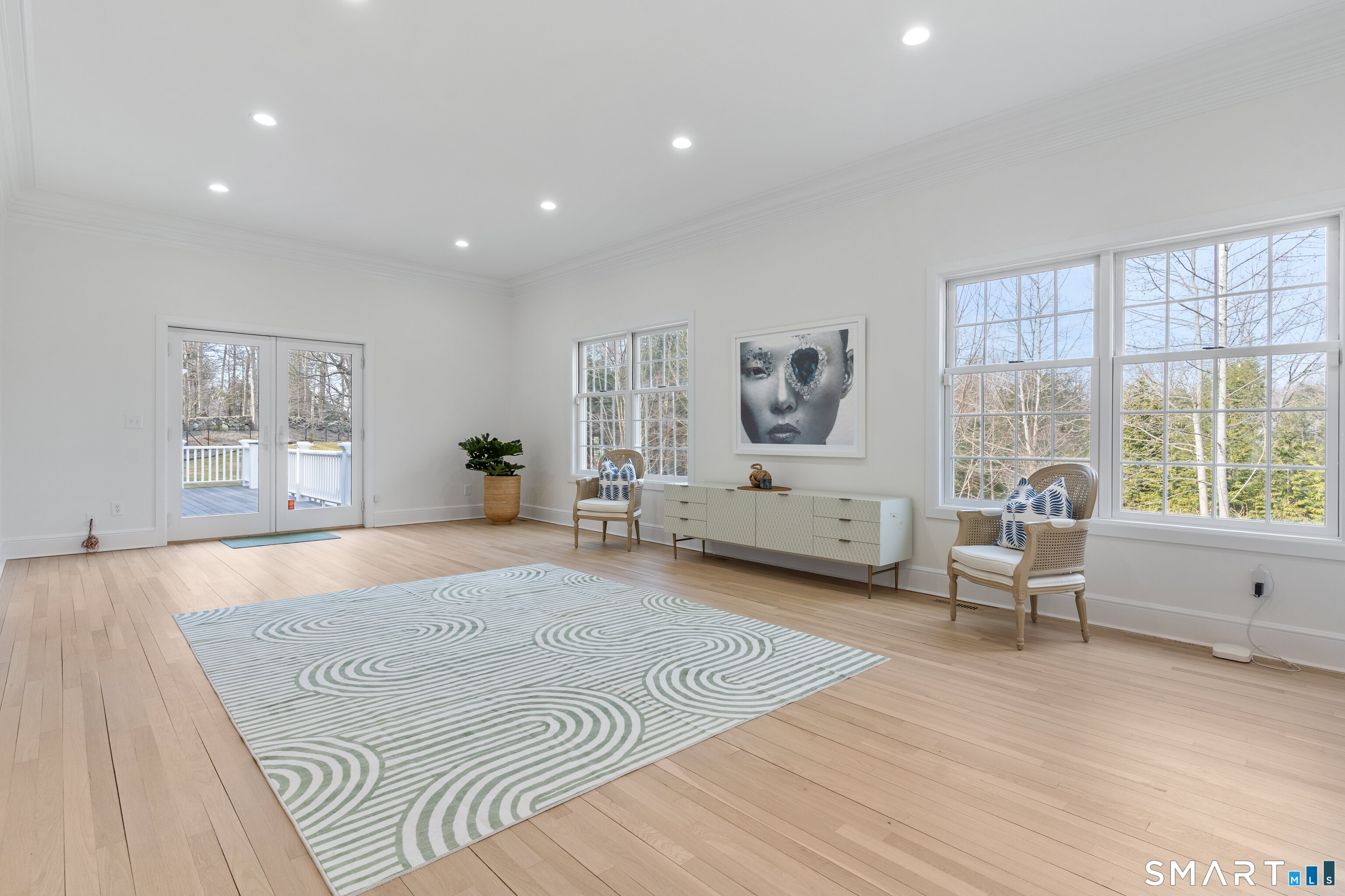 14 Windermere Lane Stamford, CT 06902 - Photo 9 of 45 a spacious bedroom with a large bed and a large window